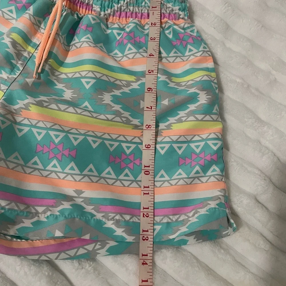 chubbies Turquoise Aztec Swim Trunks with Pink and Yellow Accents
